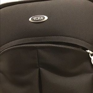 Tumi rolling carry-on bag
